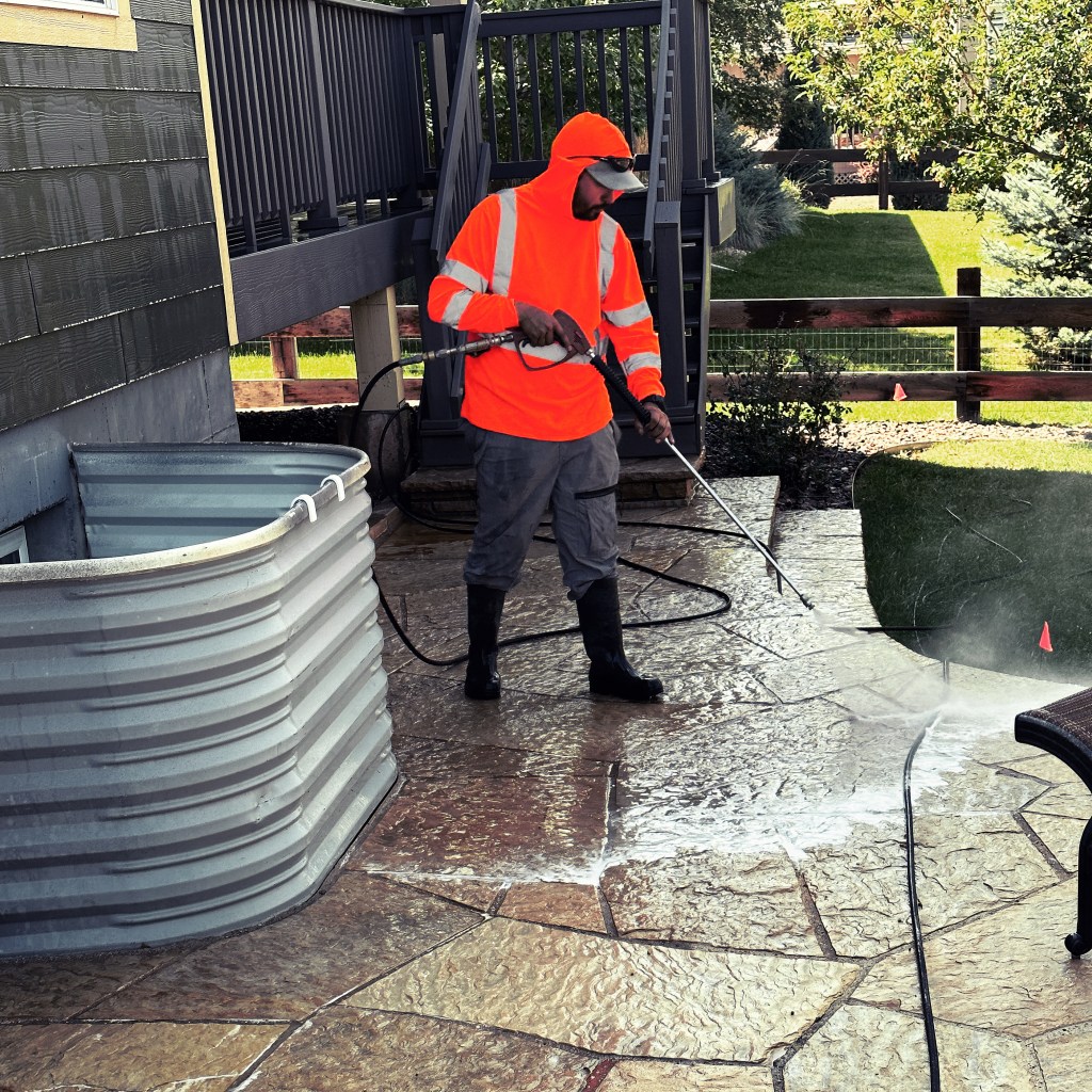 man power sweeping and pressure washing